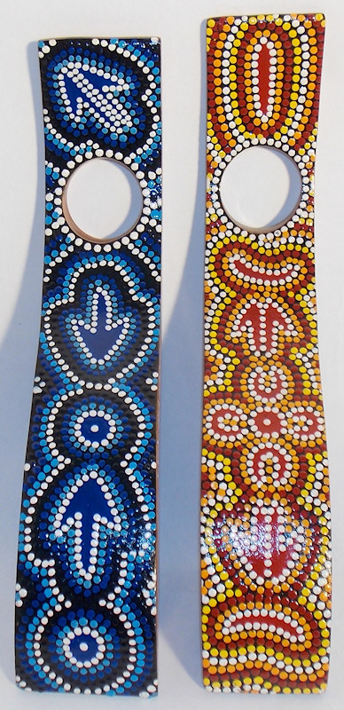 S-shaped wine bottle holders. Hand painted by aboriginal artist 